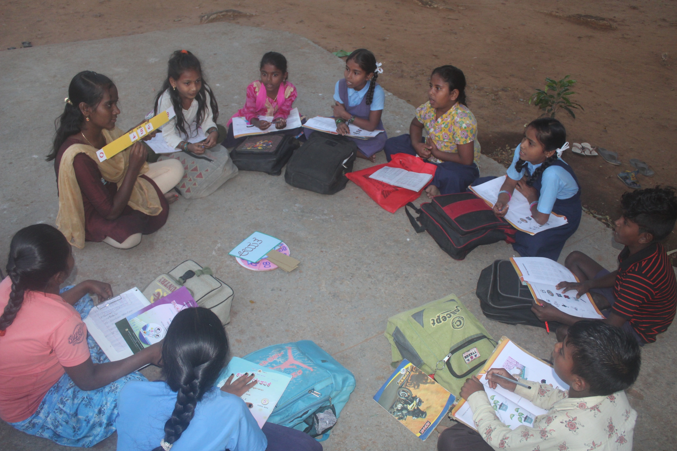 children in a village learning center